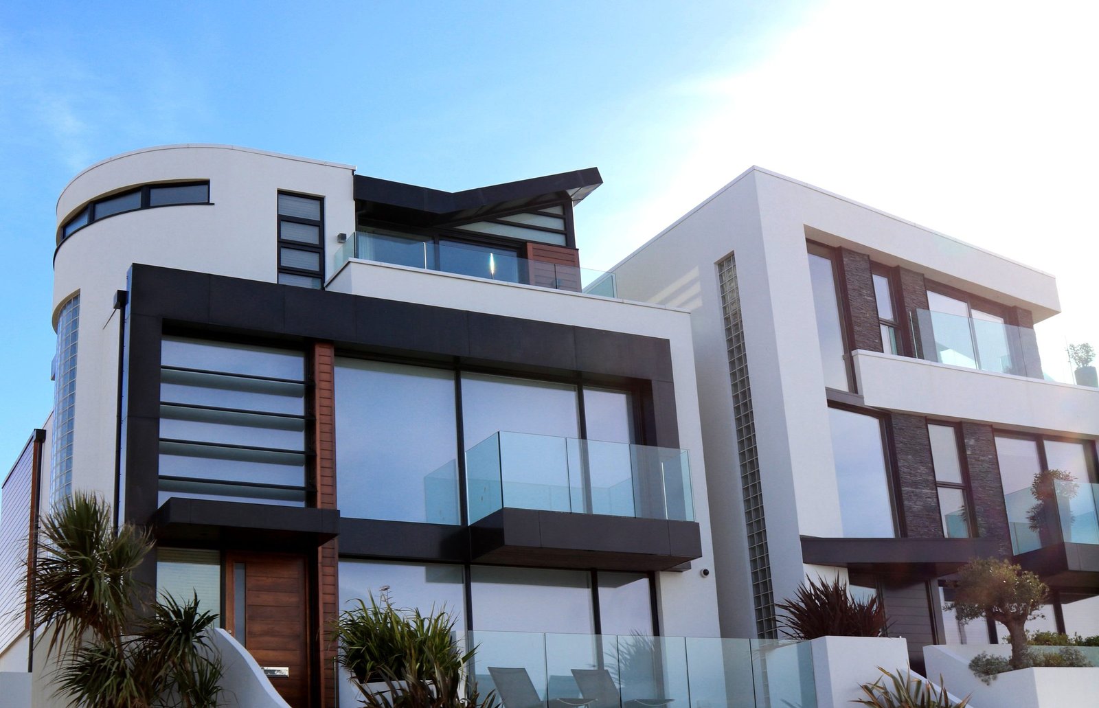 Modern two-storey house with large glazing at dusk