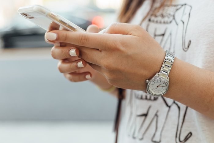 Person checking spending on a phone