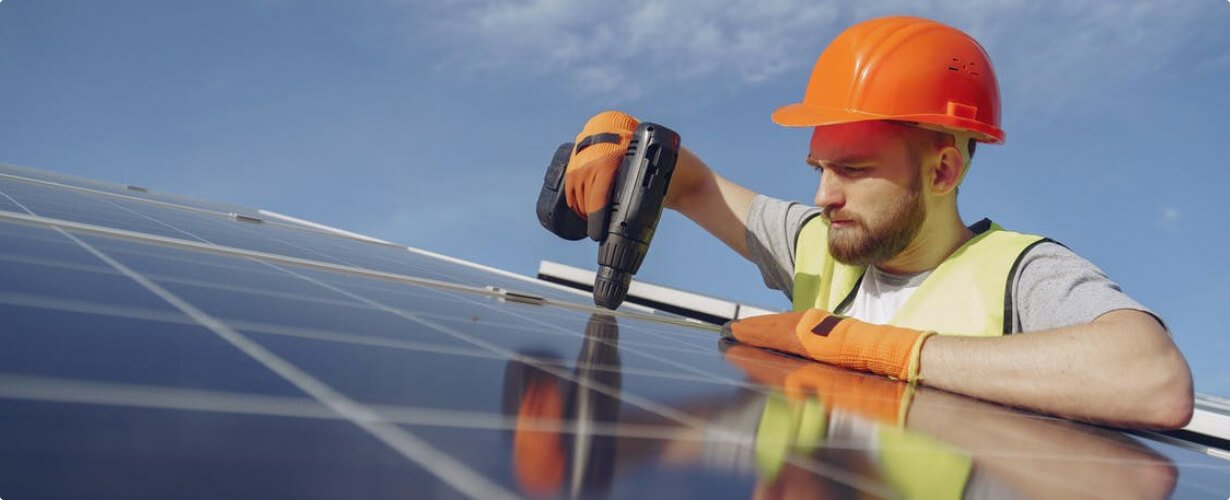 Engineer installing solar panels