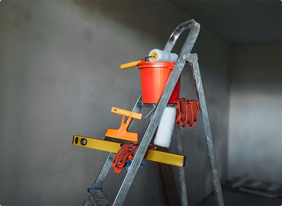 Stepladder and painting tools during repairs