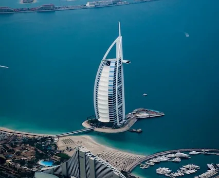 Sail-shaped Burj Al Arab hotel on its island seen from the air