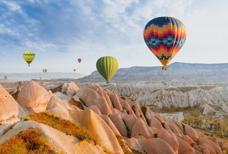 Hot air balloons over the rock formations of Cappadocia