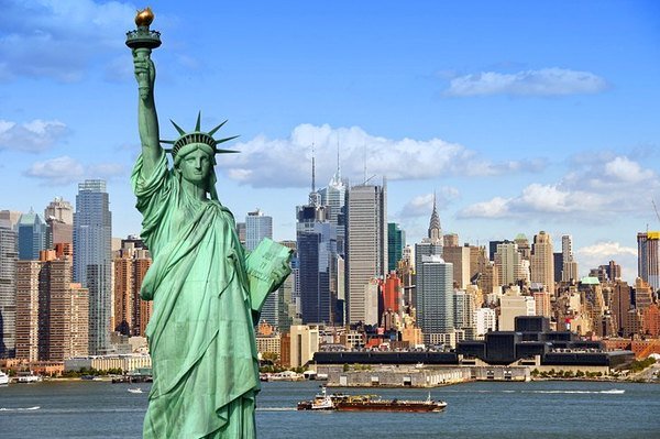 The Statue of Liberty with the New York skyline behind it