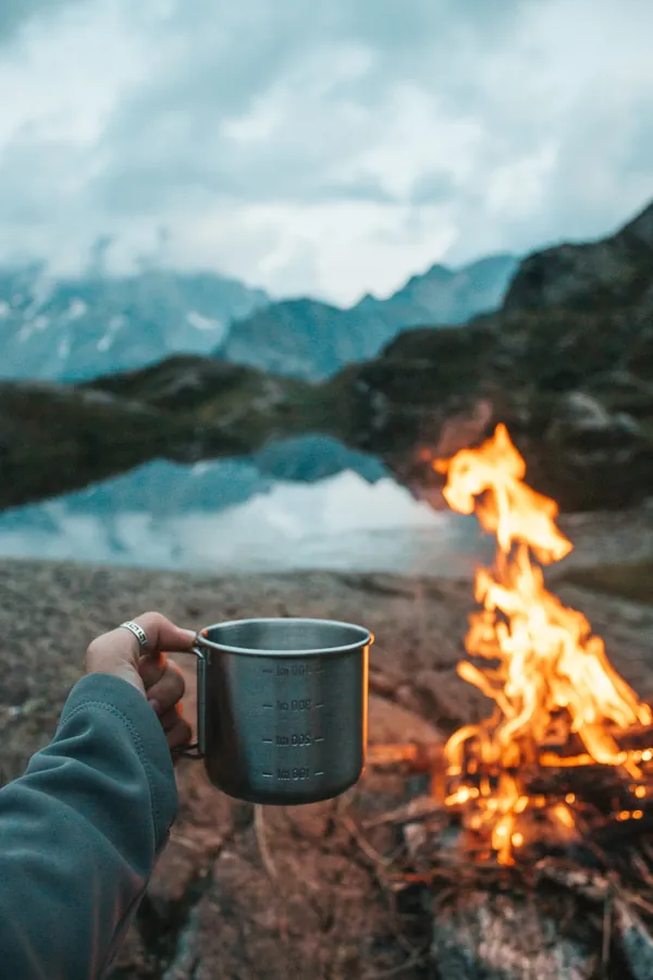 Campfire burning after dark at a camp site