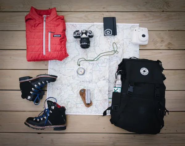 Trekking gear laid out before a departure